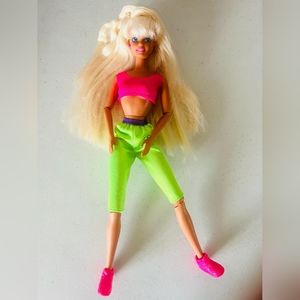 Vintage bicycling barbie doll